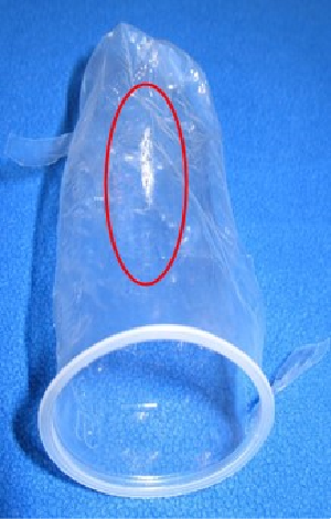 Figure 1 - Wax-like contamination on the surface of polyethylene plastic baby bottle liners.